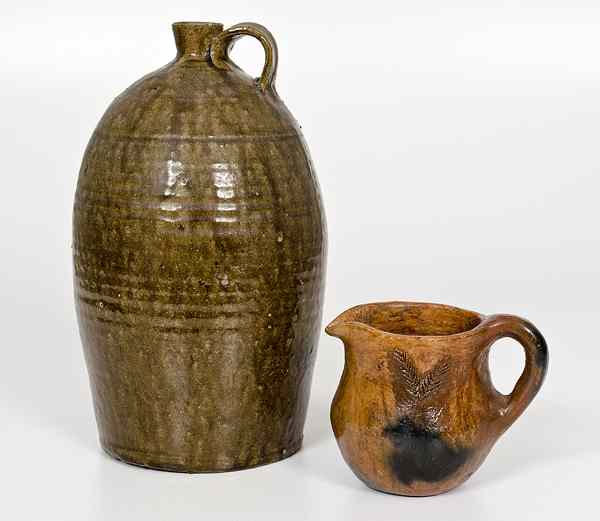 Appraisal: Alkaline Glazed Stoneware Jug Plus American an alkaline glaze stoneware