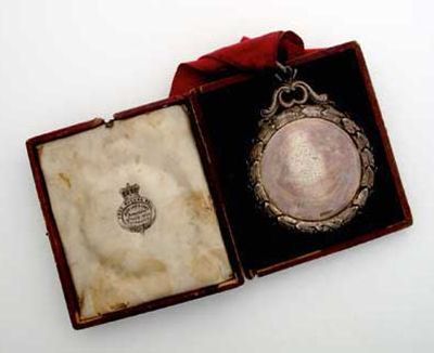 Appraisal: A Victorian prize medal with a cast foliate border inscribed