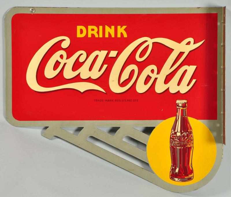 Appraisal: Tin Coca-Cola Flange Sign Description Die-cut design with bottle Strong