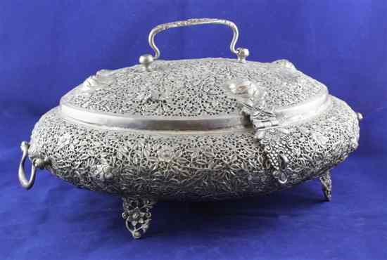 Appraisal: A large Indian pierced white metal two handled casket with