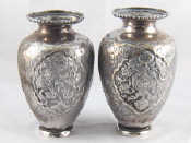 Appraisal: A pair of white metal tests silver vases unascribed marks