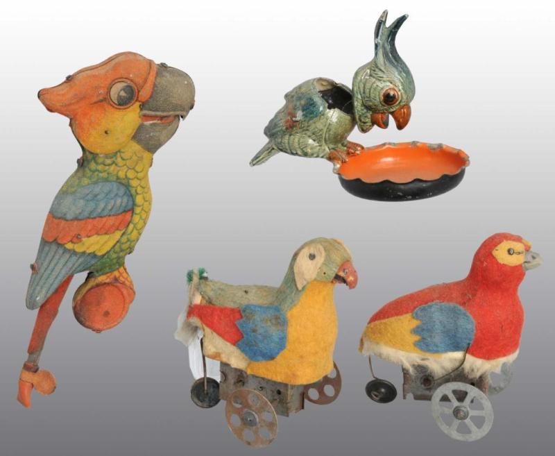 Appraisal: Lot of Tin Parakeet Toys Description German Working Includes one