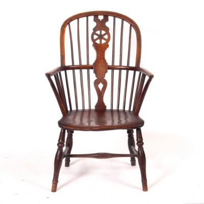 Appraisal: A stick and pierced splat back armchair with solid elm