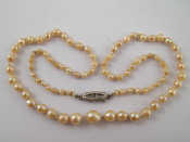 Appraisal: A graduated cultured pearl necklace largest pearl approx mm with