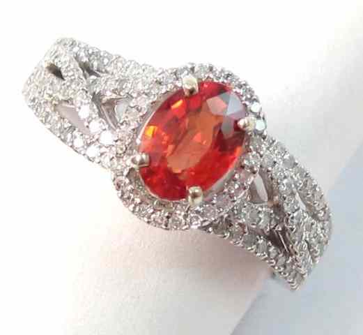 Appraisal: ORANGE SAPPHIRE AND DIAMOND RING k white gold with pave'