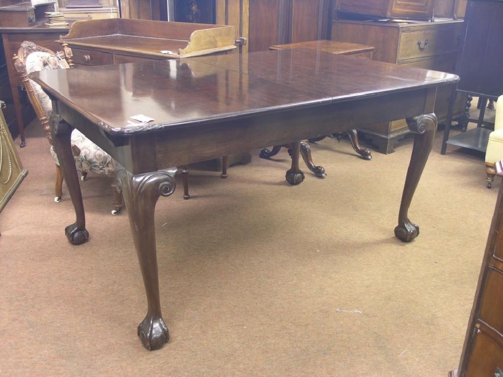 Appraisal: An early th century mahogany draw-leaf dining table on carved