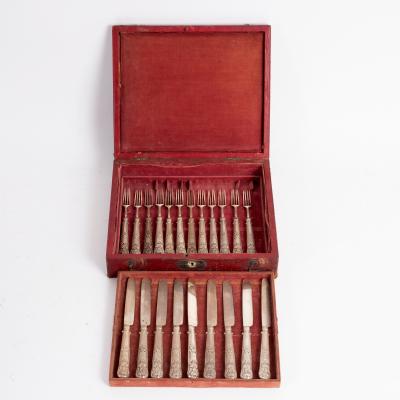 Appraisal: Nine silver dessert knives and twelve forks Sheffield with flower