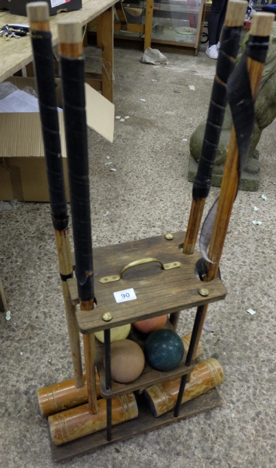 Appraisal: A croquet set with wooden stand