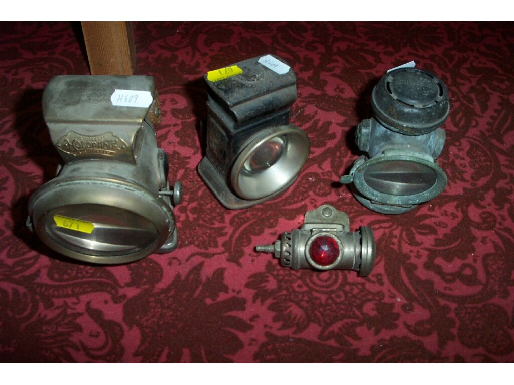 Appraisal: A collection of three motoring lamps including Lucas Holophote example