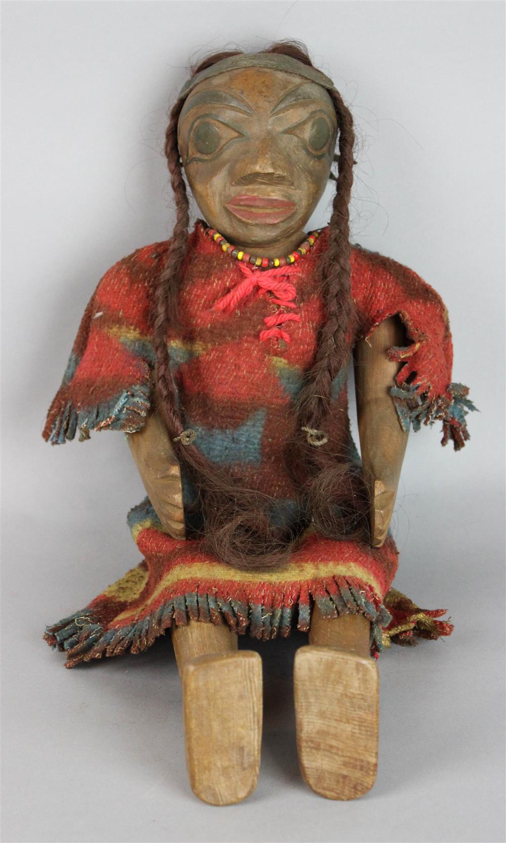 Appraisal: PACIFIC NORTHWEST COAST CEDAR CARVED ARTICULATED DOLL with trade wool