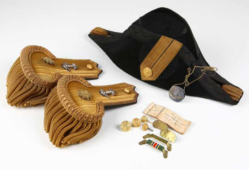 Appraisal: A cased American Naval Officer's bicorn hat epaulettes and belt