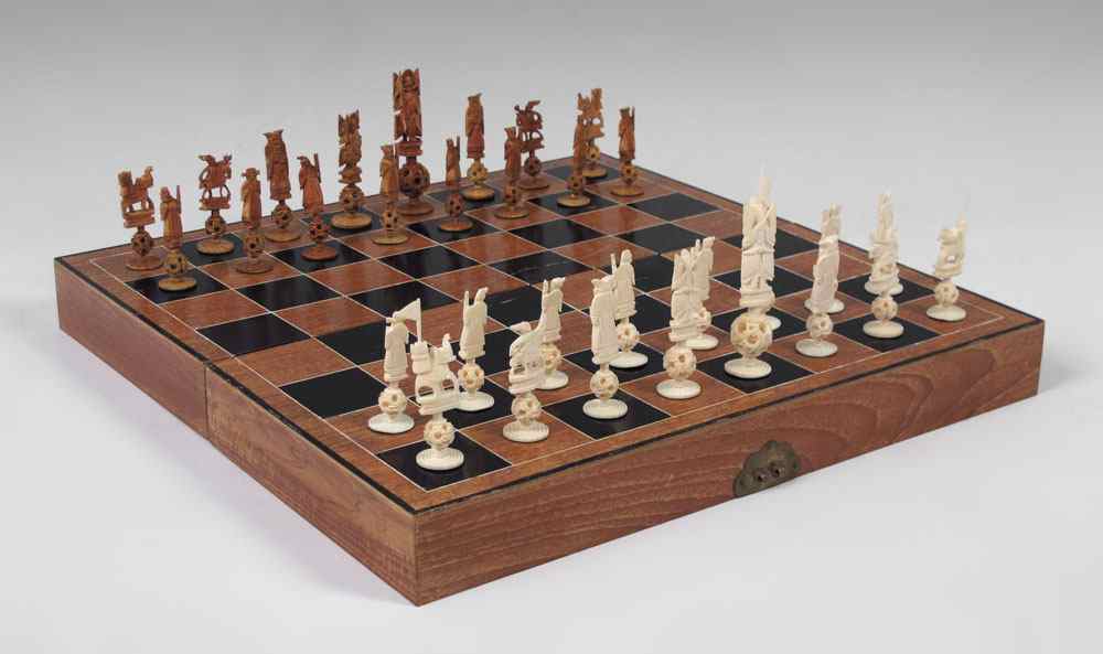 Appraisal: CHINESE CARVED IVORY CHESS SET Complete set with carved figures