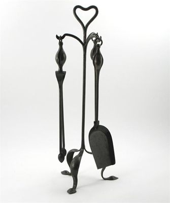 Appraisal: A set of burnished steel fire tools on a stand