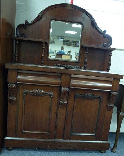 Appraisal: A late Victorian mahogany chiffonier the arched mirror back with