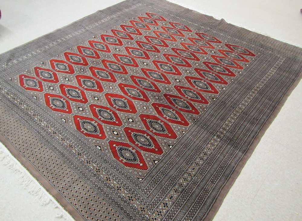 Appraisal: HAND KNOTTED ORIENTAL CARPET Turkoman Bokhara design ' x '