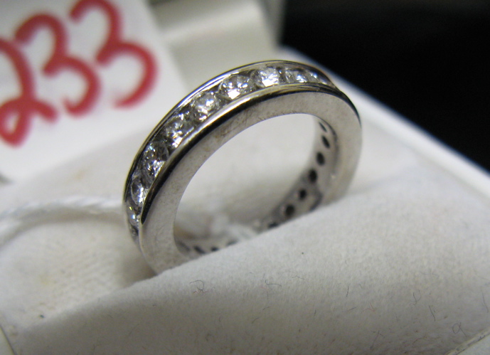 Appraisal: DIAMOND AND FOURTEEN KARAT WHITE GOLD ETERNITY RING with round