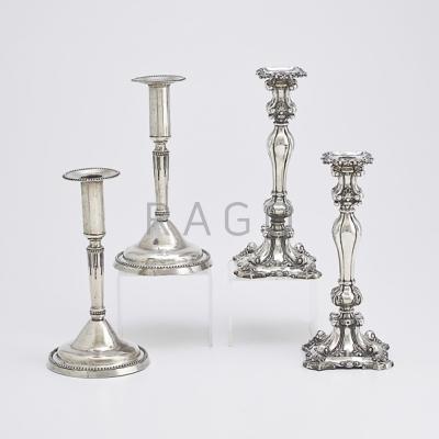 Appraisal: TWO PAIRS OF ANTIQUE SILVER CANDLESTICKS Pair of weighted floral