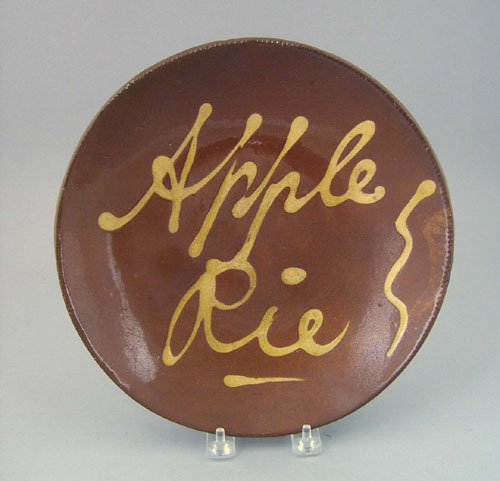 Appraisal: Redware plate th c with yellow slip inscription Apple Pie