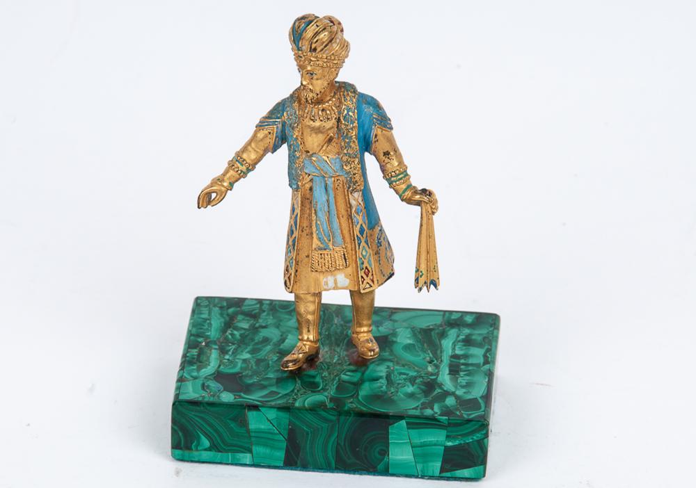 Appraisal: RUSSIAN GILT ENAMELED BRONZE FIGUREmounted to a malachite base Provenance