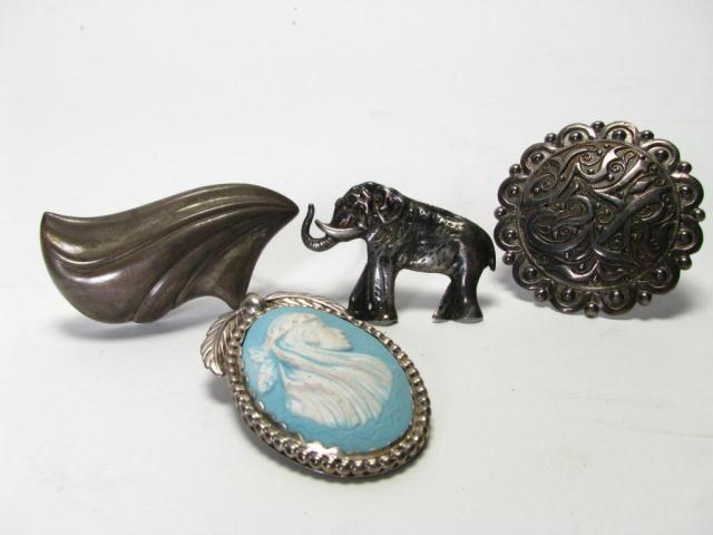 Appraisal: Four Sterling Silver Brooches including an elephant a cameo style