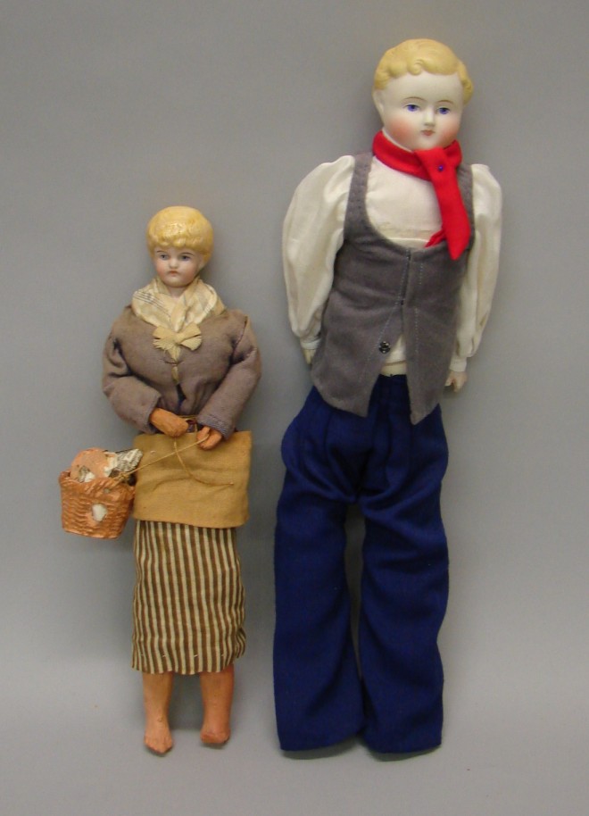 Appraisal: Pair of dolls with molded features and blonde hair Lady