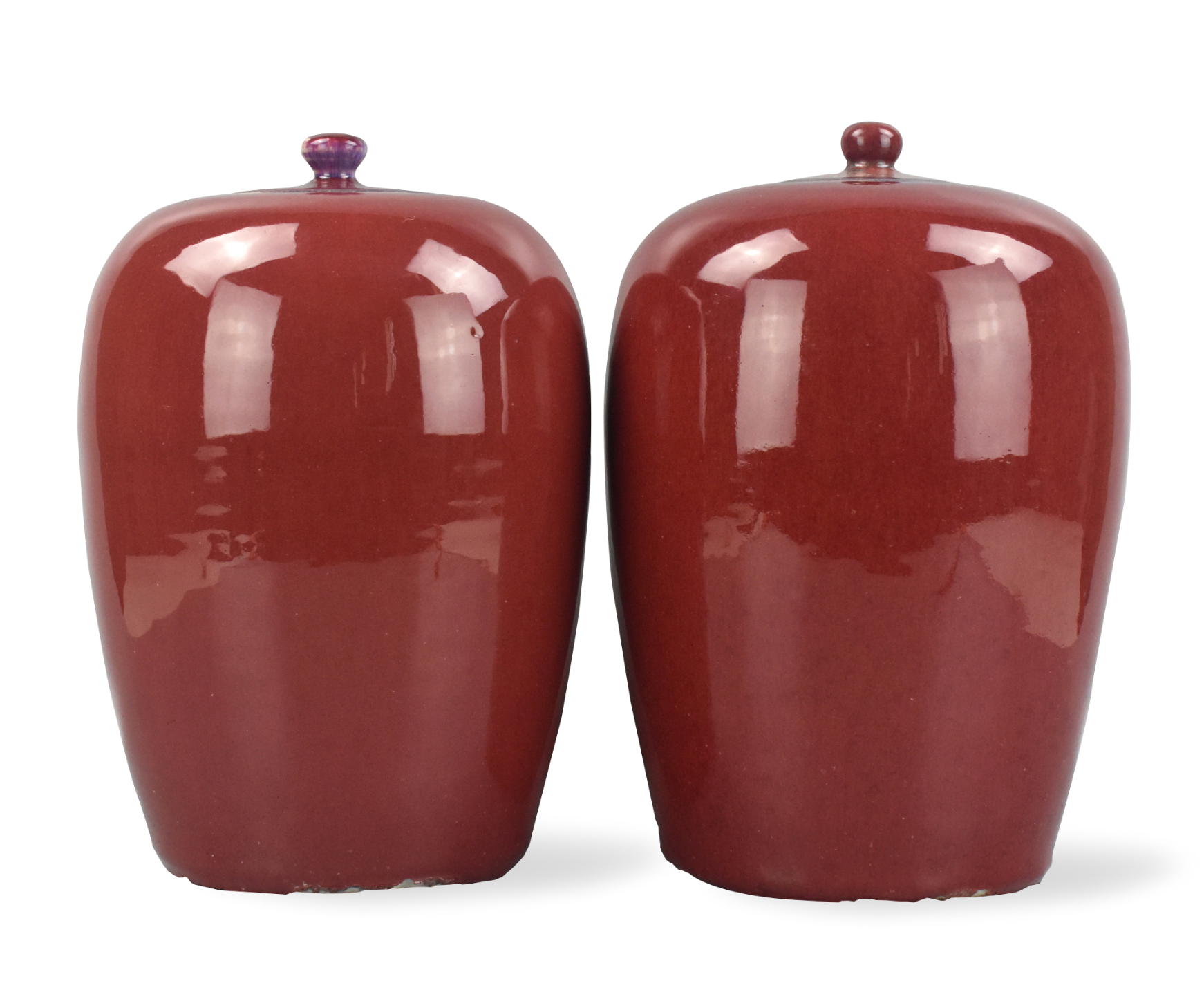 Appraisal: A pair of Chinese flambe glazed jars with covers Covers