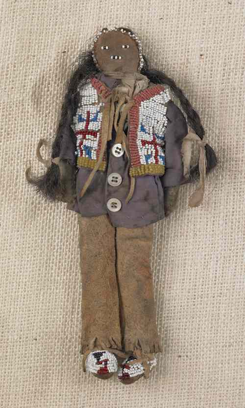 Appraisal: Plains beaded hide and cloth doll with hide leggings beaded