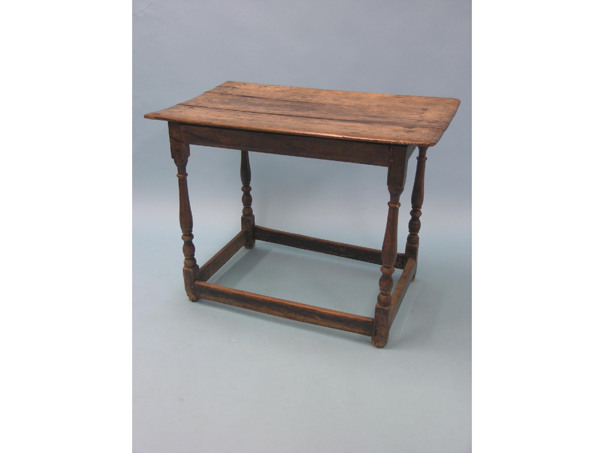 Appraisal: An th century oak side table three-plank top on baluster-turned