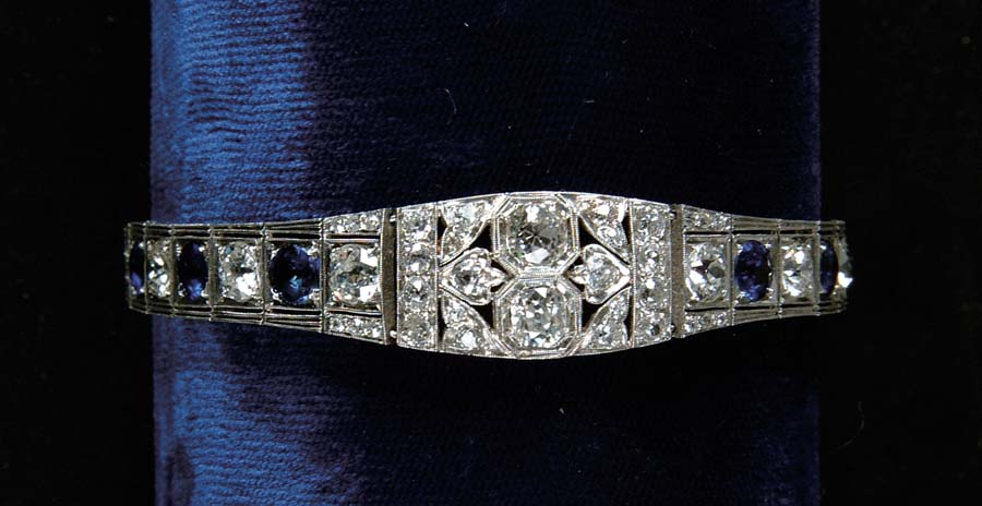 Appraisal: DIAMOND SAPPHIRE BRACELET Spectacular platinum bracelet is accented with approx