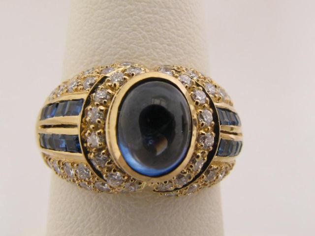 Appraisal: Lady's K yellow gold ring with large cabochon sapphire accent