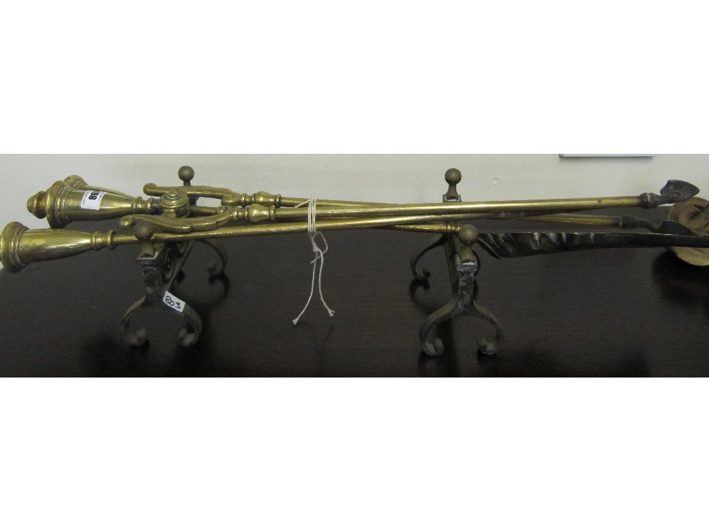 Appraisal: Pair of brass fire dogs with three brass fire irons