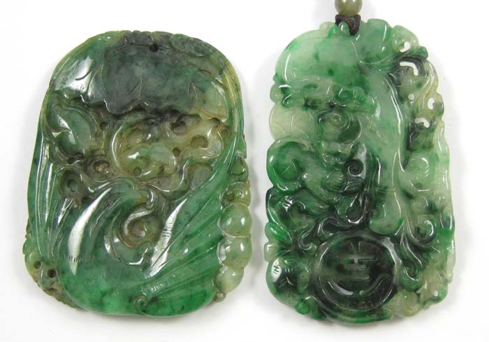 Appraisal: TWO CHINESE CARVED JADE PENDANTS each of tapering rectangular form