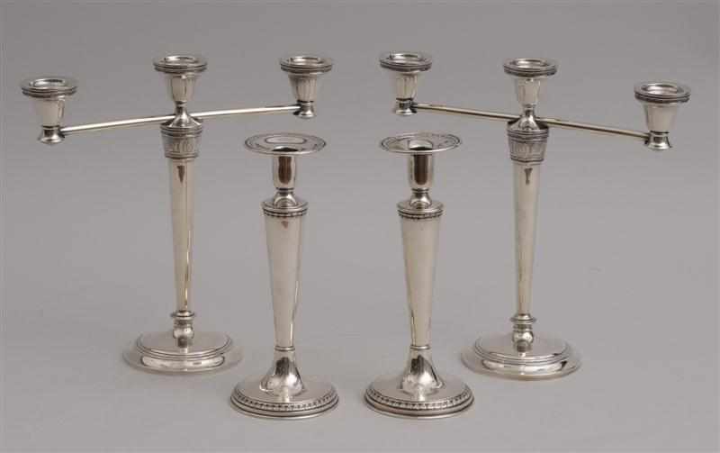 Appraisal: PAIR OF INTERNATIONAL SILVER WEIGHTED THREE-LIGHT CANDELABRA IN THE ''WEDGWOOD''