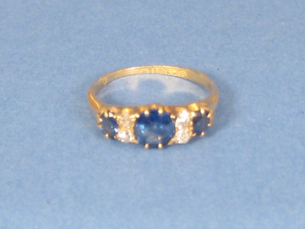 Appraisal: An ct gold Ring set three sapphires and four diamonds