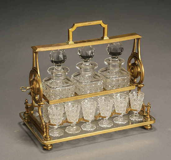 Appraisal: Edwardian Ormolu Tantalus with Three Button-Cut Glass Decanters and Twelve