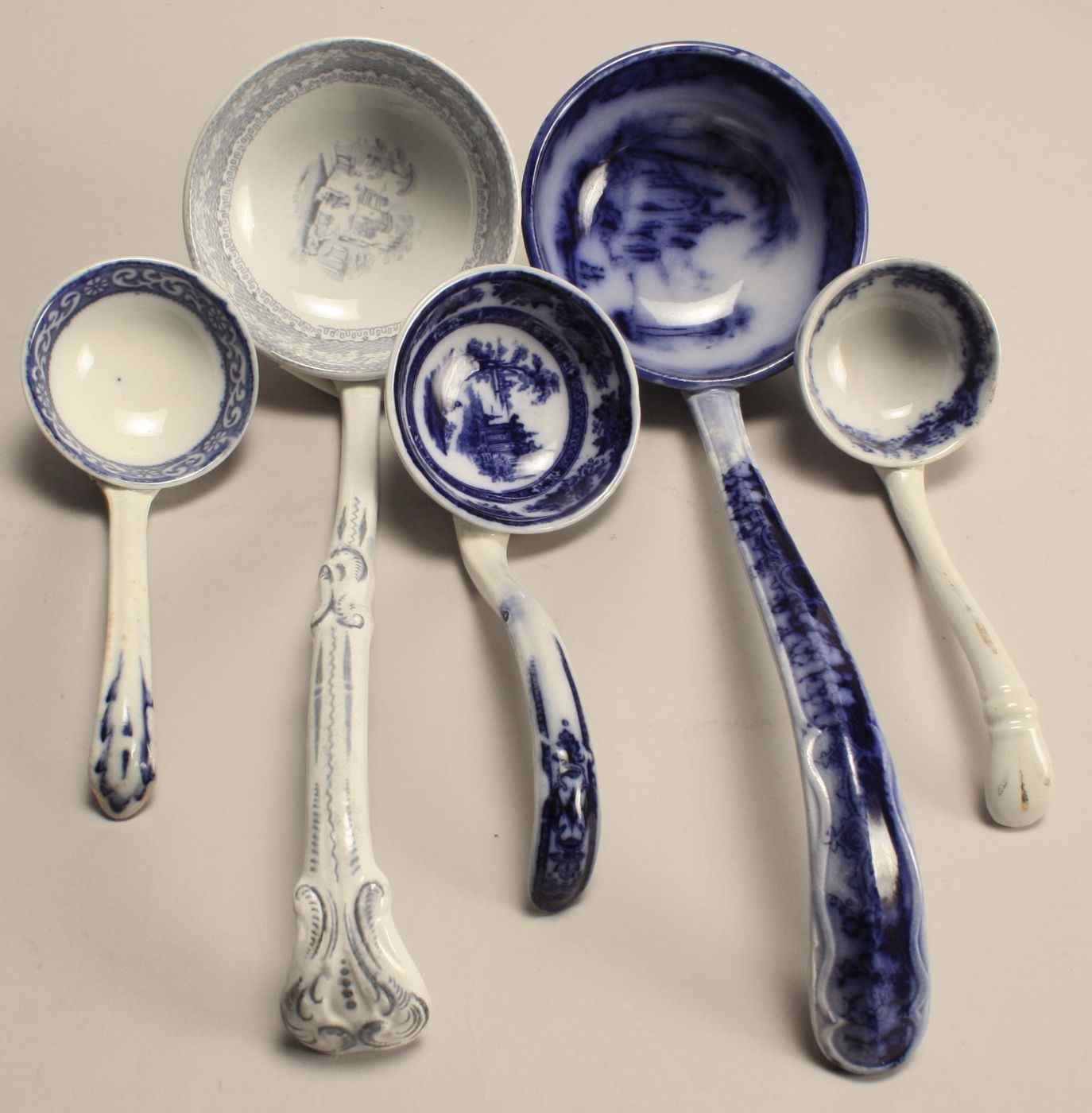 Appraisal: FIVE ASSORTED IRONSTONE LADLESEnglish th CenturyOne Flow Blue and one