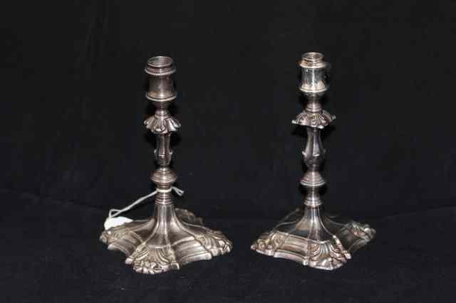 Appraisal: TWO OLD SILVER COLOURED METAL CANDLESTICKS with turned stems high