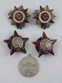 Appraisal: Four Russian enamelled badges with screw fittings and a white