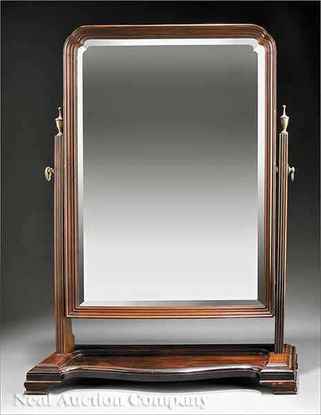 Appraisal: An English Carved Mahogany Dressing Mirror late th c shaped