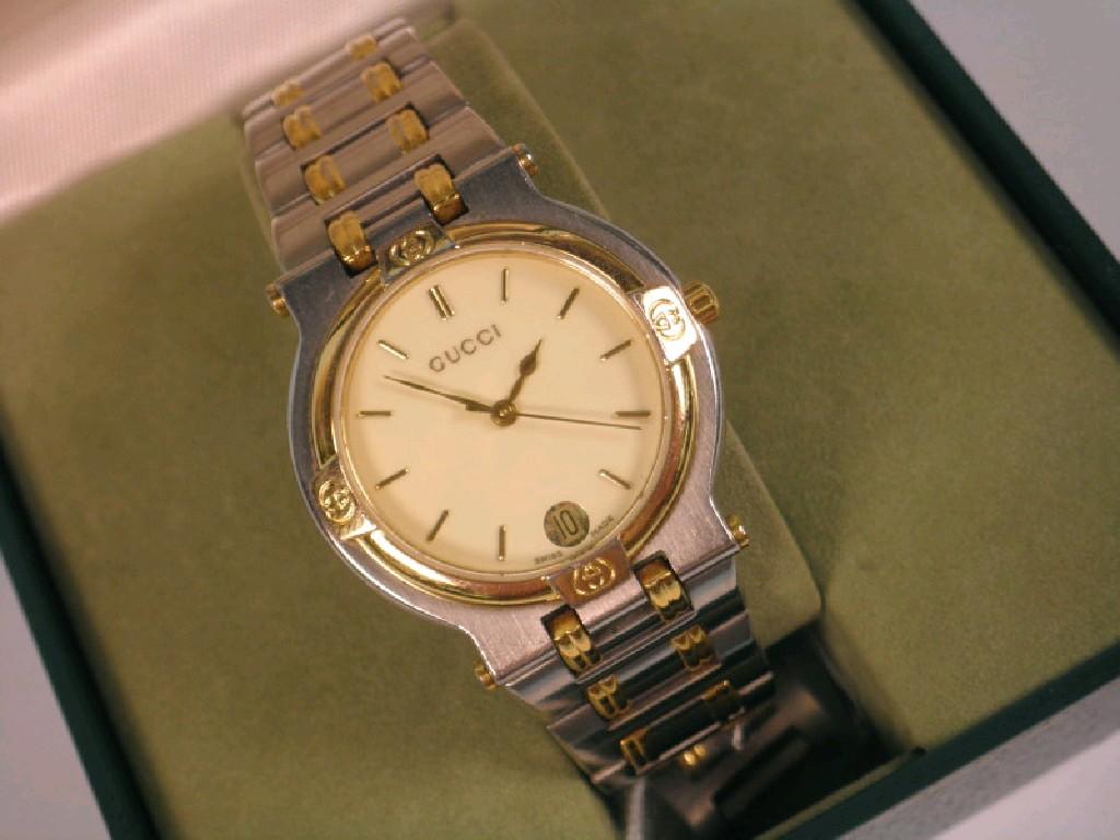 Appraisal: A mid size Gucci bi-colour metal wrist watch with box