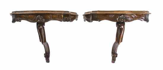 Appraisal: A Pair of Continental Carved Walnut Wall Brackets each having