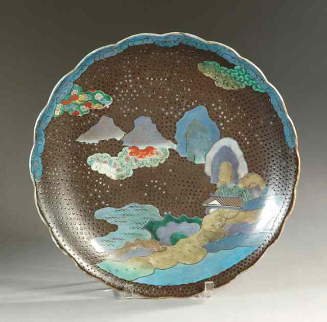 Appraisal: JAPANESE KUTANI PORCELAIN CHARGER Hand painted with half-hidden home peeking