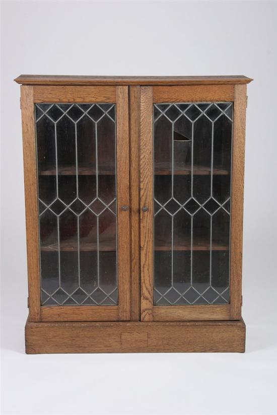 Appraisal: OAK BARRISTER BOOKCASE early th century Projecting molded-edge crown conforming