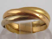 Appraisal: A French hallmarked three colour carat gold Russian wedding ring