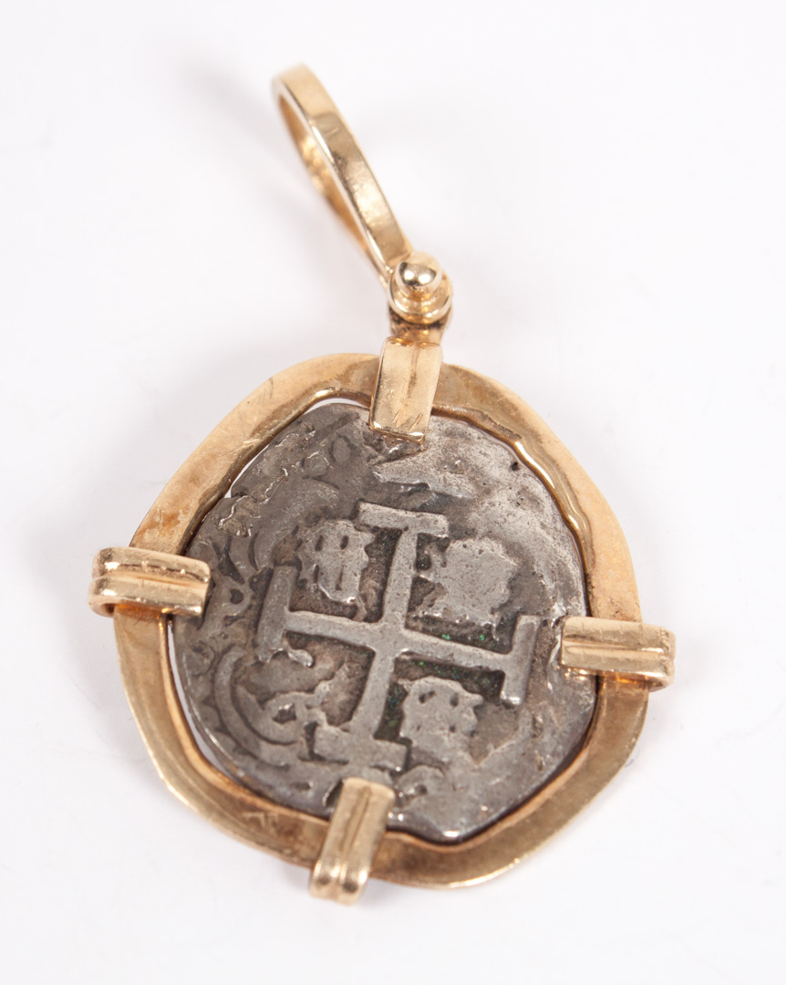 Appraisal: Spanish silver real coin pendant with gold pendant mount in