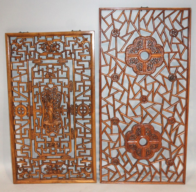 Appraisal: A matched pair of Chinese hardwood panels the first of