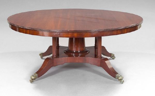 Appraisal: Regency-Style Mahogany Horseshoe Dining Table the circular top fitted with