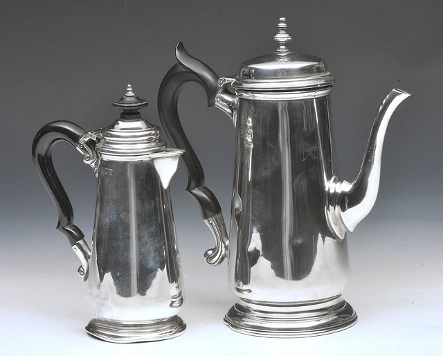 Appraisal: A SILVER SMALL GEORGIAN STYLE COFFEE POT with hardwood handle