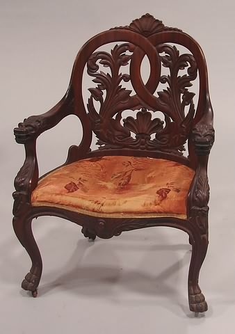 Appraisal: Mahogany bent wood reticulated carved chair with twin dolphins on