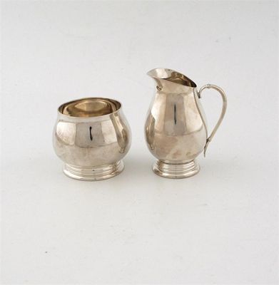 Appraisal: A modern Danish cream jug and a matching sugar bowl